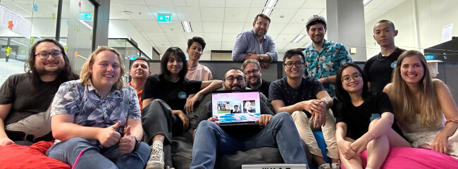 The NurtureCloud team, including remote workers, huddled for a group photo