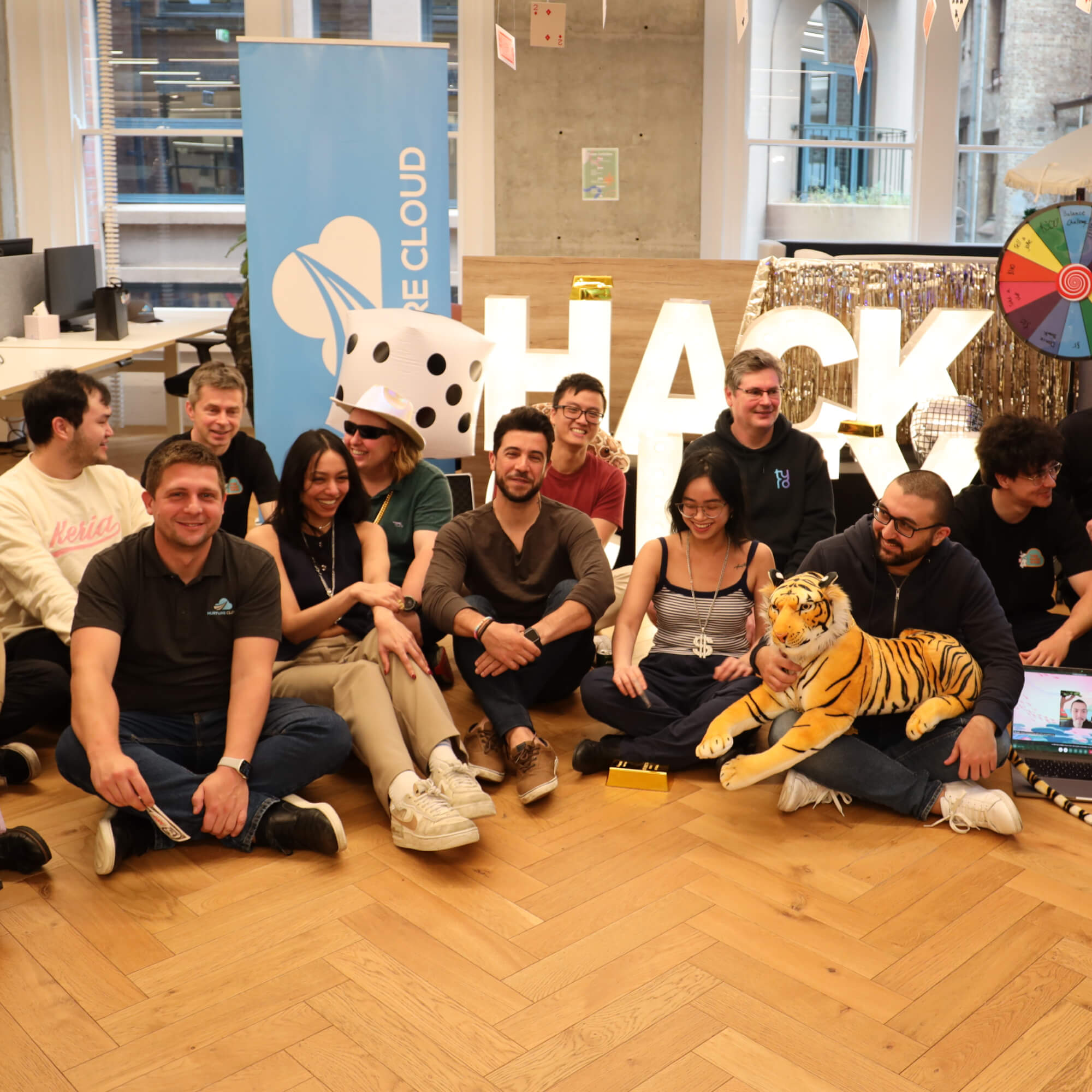 A NurtureCloud team group photo during a Las Vegas-themed hackathon event