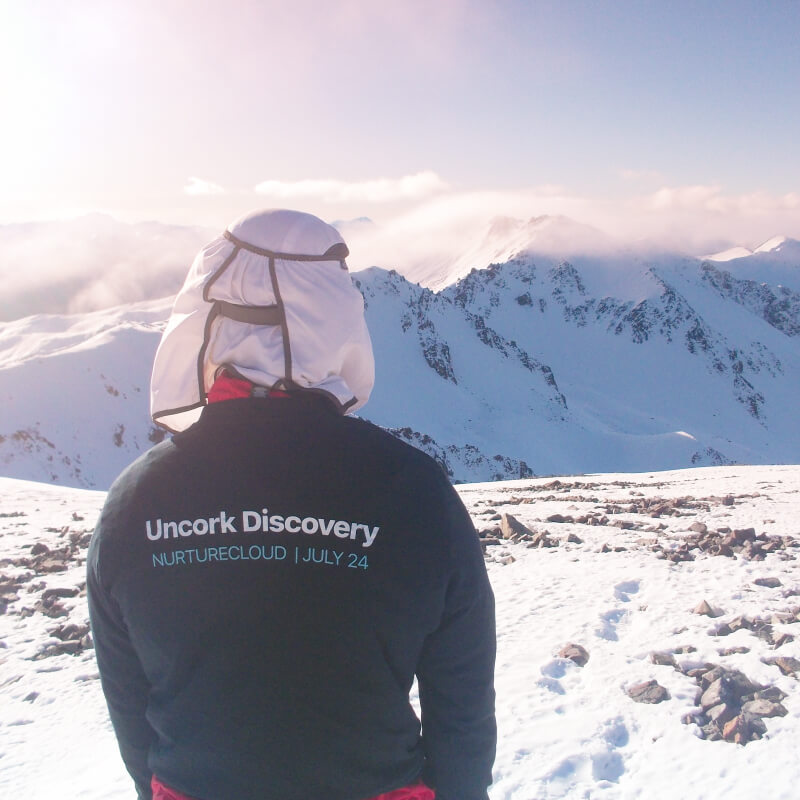 NurtureCloud's Winson at the top of a mountain