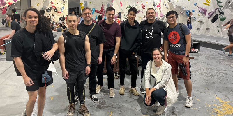 NurtureCloud team group photo at a rock-climbing event.